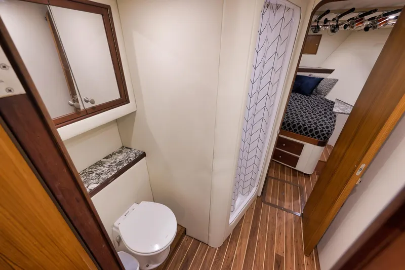 Slide: The Image of Luxurious 2004 Guthrie 60 Custom Carolina yacht interior with bathroom and cozy bedroom. - 41