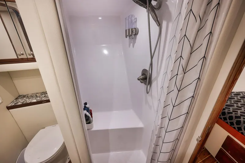 Slide: The Image of Compact bathroom in 2004 Guthrie 60 Custom Carolina yacht with shower and toilet. - 42