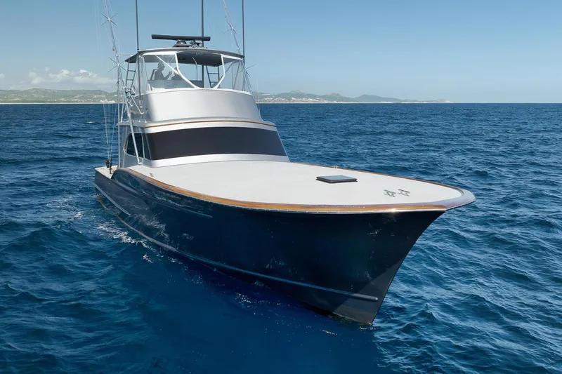 Slide: The Image of 2004 Guthrie 60 Custom Carolina yacht cruising on open sea. - 44