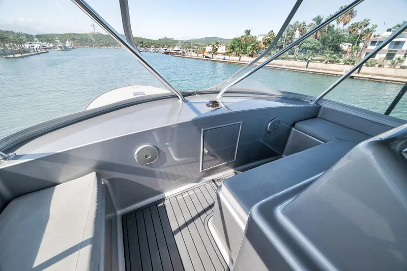 Slide: The Image of 2004 Guthrie 60 Custom Carolina boat interior with sleek seating and waterfront view. - 46