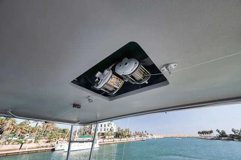 Slide: The Image of Ceiling view of 2004 Guthrie 60 Custom Carolina boat with winch system, near marina. - 52
