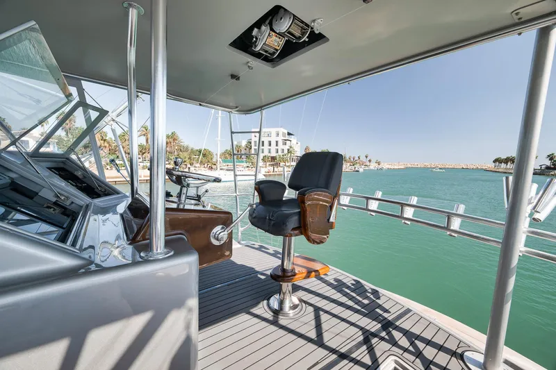 Slide: The Image of 2004 Guthrie 60 Custom Carolina yacht helm with ocean view and luxurious seating. - 54