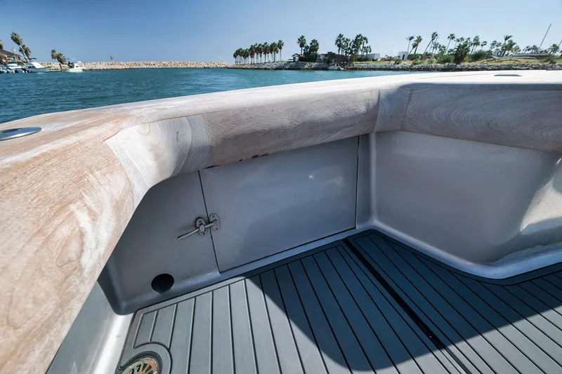 Slide: The Image of 2004 Guthrie 60 Custom Carolina boat deck with wooden railing and ocean view. - 62