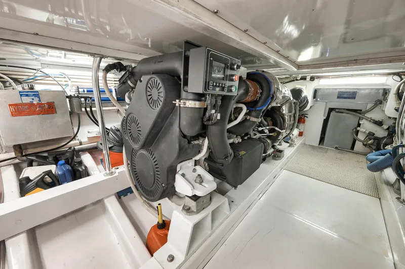 Slide: The Image of Engine room of 2004 Guthrie 60 Custom Carolina boat, showcasing mechanical components and equipment. - 75