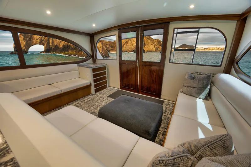 Slide: The Image of Luxurious interior of 2004 Guthrie 60 Custom Carolina yacht with ocean view through large windows. - 8