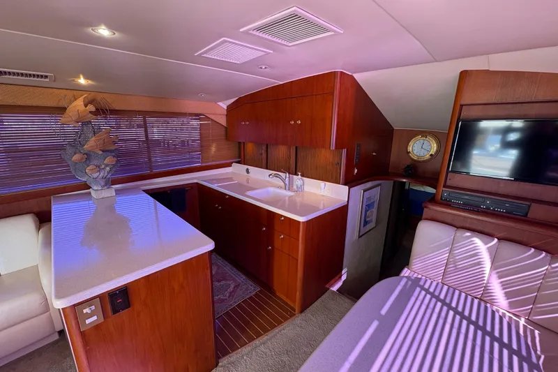 Slide: The Image of Luxurious interior of a 1996 Ocean Yachts 48 Super Sport with modern amenities. - 13