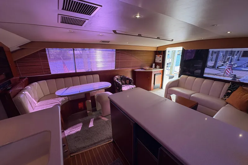 Slide: The Image of Luxurious interior of a 1996 Ocean Yachts 48 Super Sport with elegant seating and ambient lighting. - 11