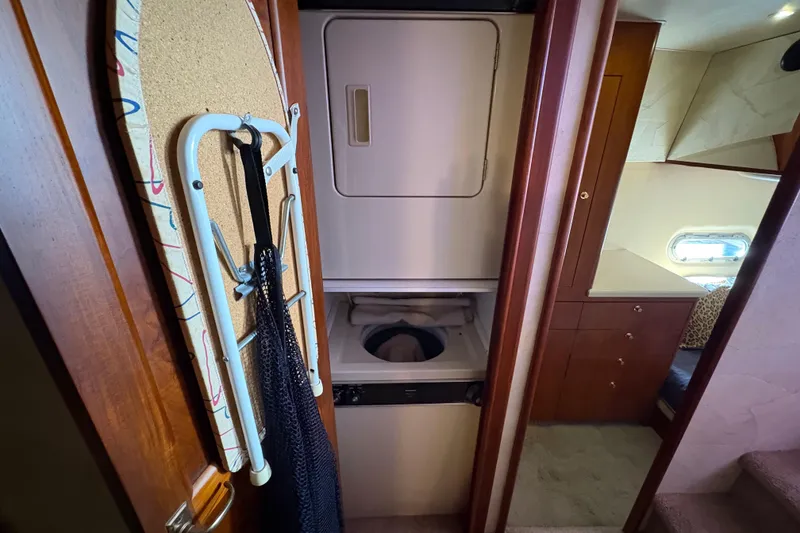Slide: The Image of Laundry area with ironing board in 1996 Ocean Yachts 48 Super Sport interior. - 23