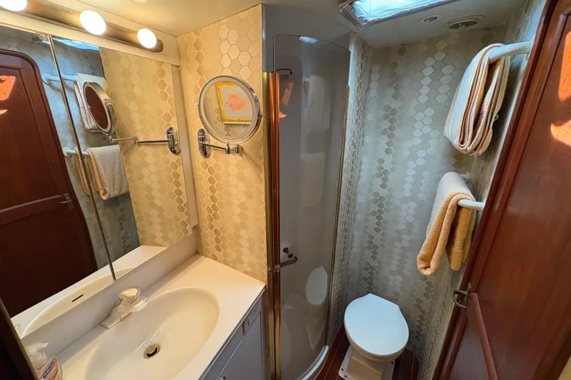 Slide: The Image of Bathroom interior of 1996 Ocean Yachts 48 Super Sport with shower and vanity. - 27
