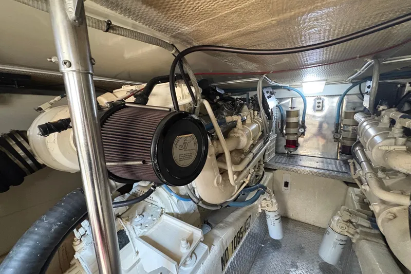 Slide: The Image of Engine room of a 1996 Ocean Yachts 48 Super Sport, showcasing mechanical components. - 45