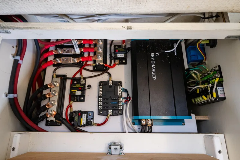 Slide: The Image of Electrical system of a 2006 C-Dory 25' Tomcat Catamaran, featuring battery charger and wiring. - 30