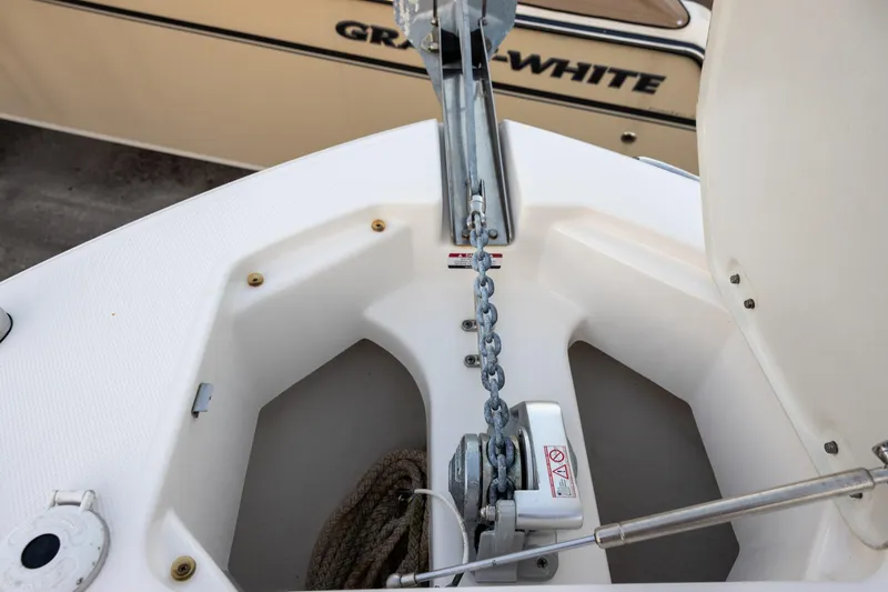 Slide: The Image of 2020 Robalo R247 Dual Console anchor chain and storage compartment. - 12