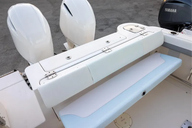 Slide: The Image of 2020 Robalo R247 Dual Console boat with Yamaha engines and foldable seating. - 5