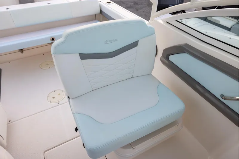 Slide: The Image of 2020 Robalo R247 Dual Console boat seat, white and light blue upholstery. - 8