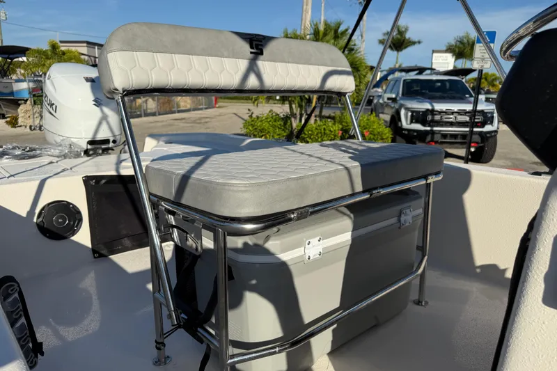 Slide: The Image of 2026 Carolina Skiff E20 JVX CC boat console with steering wheel and controls. - 16