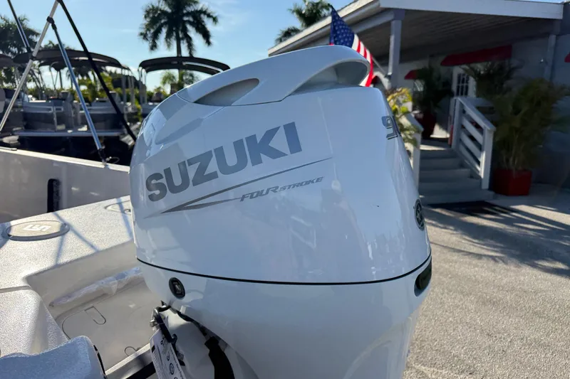 Slide: The Image of 2026 Carolina Skiff E20 JVX CC boat console with steering wheel and gauges. - 17