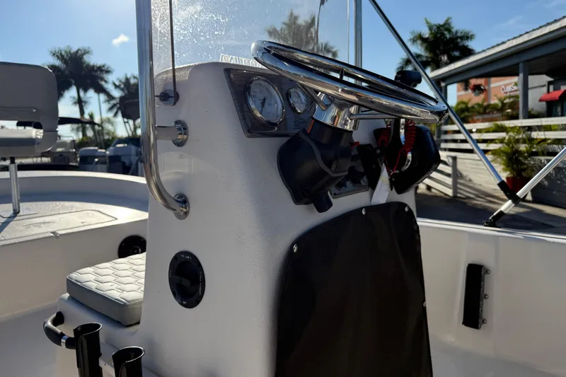 Slide: The Image of Carolina Skiff E20 JVX CC 2026 model with identification plate and contact information. - 18