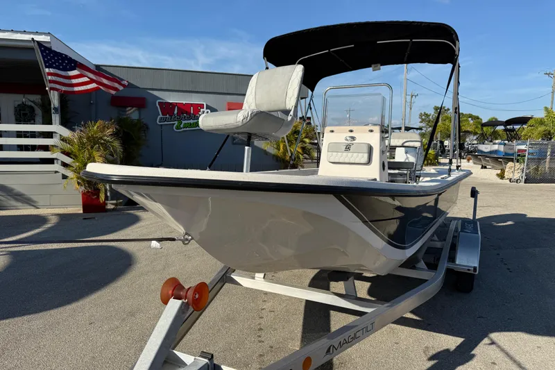 Slide: The Image of 2026 Carolina Skiff E20 JVX CC boat on trailer, parked outdoors under clear sky. - 3