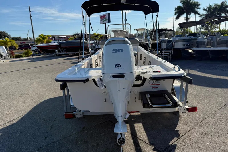 Slide: The Image of 2026 Carolina Skiff E20 JVX CC boat with Suzuki outboard motor on trailer. - 6