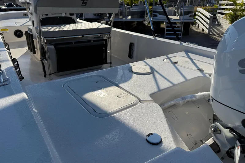 Slide: The Image of 2026 Carolina Skiff E20 JVX CC boat interior with seating and steering console. - 9