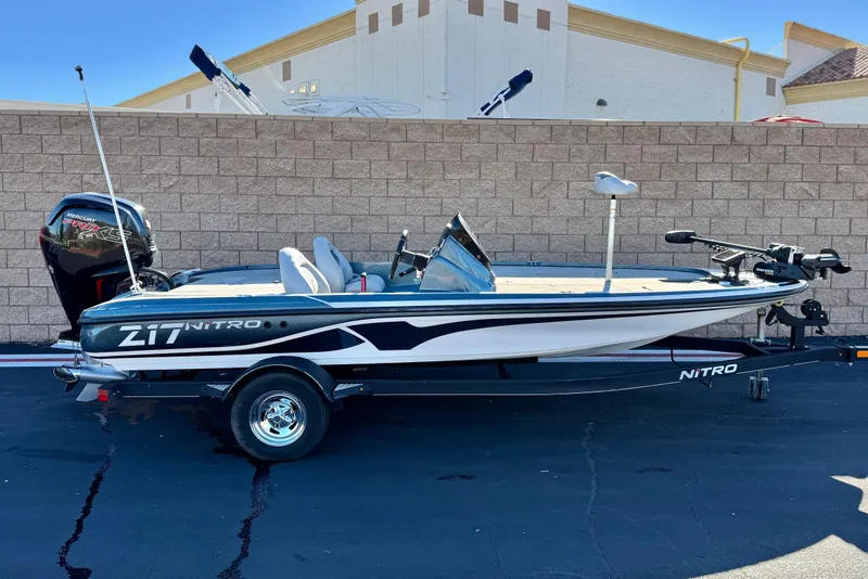 The Image of 2019 Nitro Z17 boat with Mercury engine, parked on a trailer against a brick wall. - 0