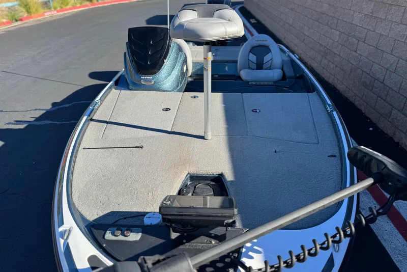 Slide: The Image of 2019 Nitro Z17 boat with seating and fishing deck, parked on pavement. - 11