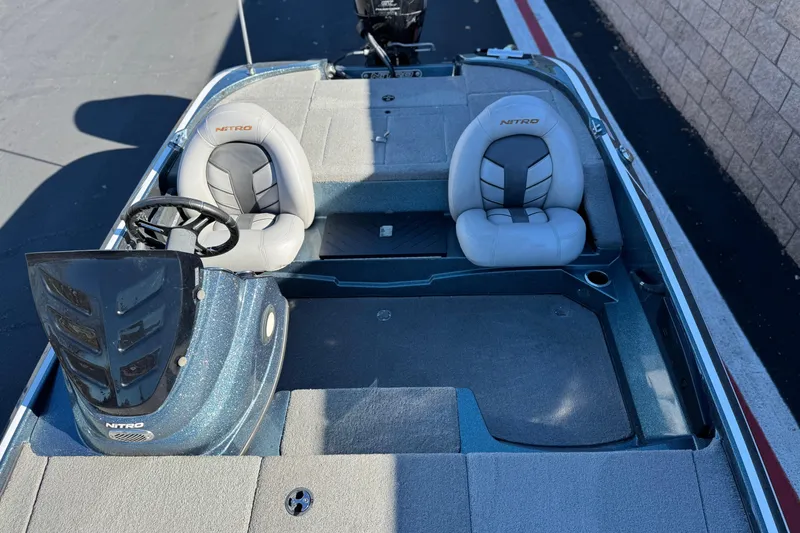 Slide: The Image of 2019 Nitro Z17 boat interior with dual seats and steering wheel. - 14