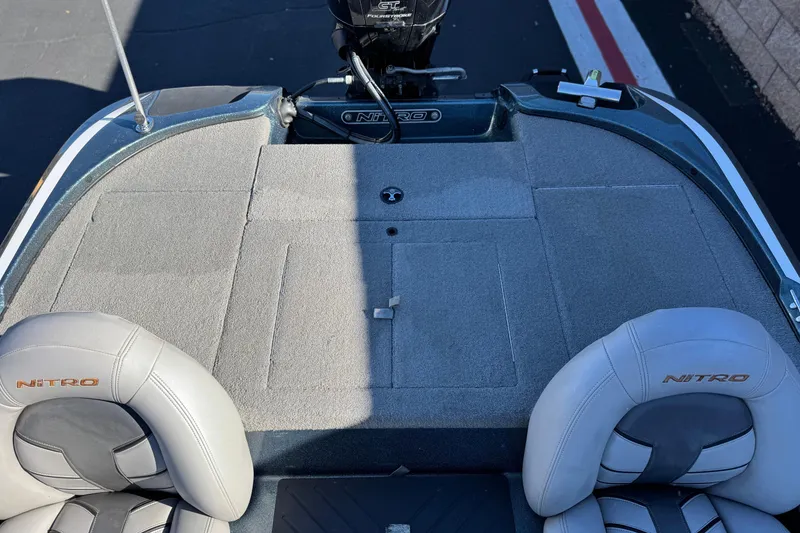 Slide: The Image of 2019 Nitro Z17 boat interior with gray carpet and branded seats. - 16
