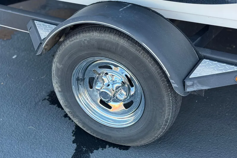 Slide: The Image of 2019 Nitro Z17 trailer wheel with chrome rim and black fender. - 22