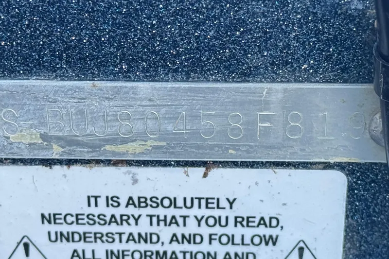 Slide: The Image of Close-up of Nitro Z17 2019 serial number plate with safety instructions. - 25