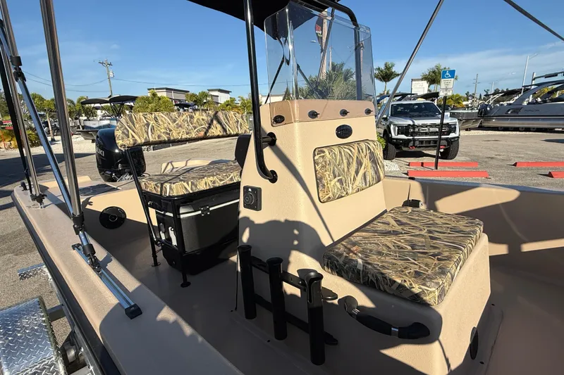 Slide: The Image of 2025 Carolina Skiff E18 JVX CC Sportman Edition boat with camouflage seating and console. - 14