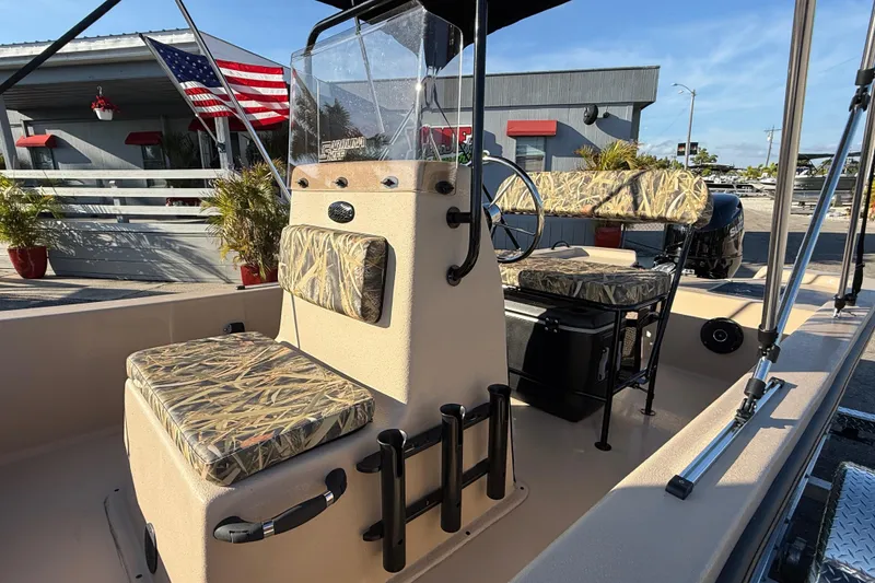 Slide: The Image of 2025 Carolina Skiff E18 JVX CC Sportman Edition boat with camouflage seating and American flag. - 17