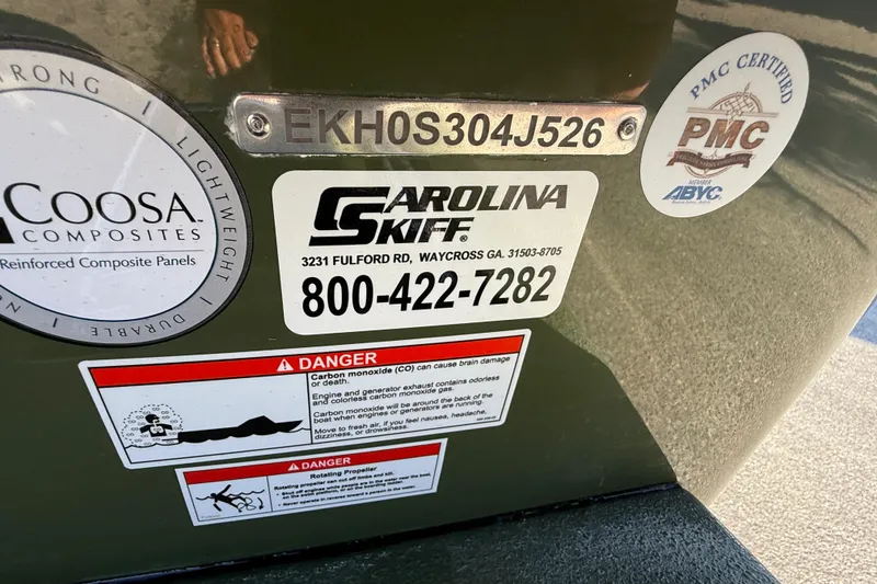 Slide: The Image of 2025 Carolina Skiff E18 JVX CC Sportman Edition with safety and certification labels. - 21