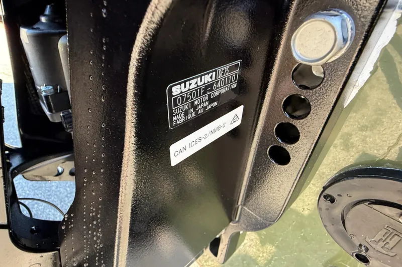 Slide: The Image of Close-up of Suzuki engine label on 2025 Carolina Skiff E18 JVX CC Sportman Edition. - 22