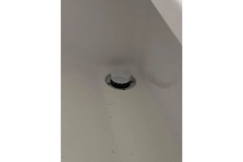 Slide: The Image of 2023 Onslow Bay 27 Offshore boat interior detail with drain plug. - 14