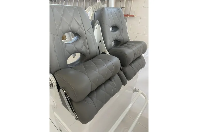 Slide: The Image of 2023 Onslow Bay 27 Offshore boat seats with gray quilted upholstery. - 6