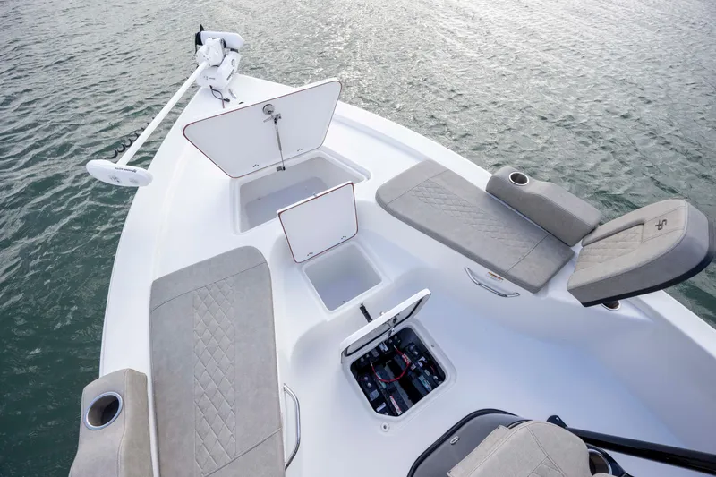 Slide: The Image of 2024 Sea Pro 228 Bay boat interior with storage compartments and seating. - 10