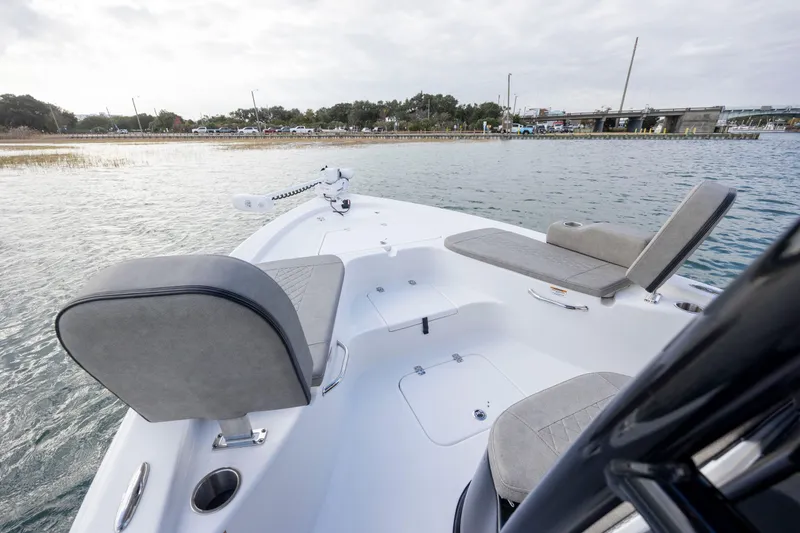 Slide: The Image of 2024 Sea Pro 228 Bay boat with comfortable seating on calm water. - 11