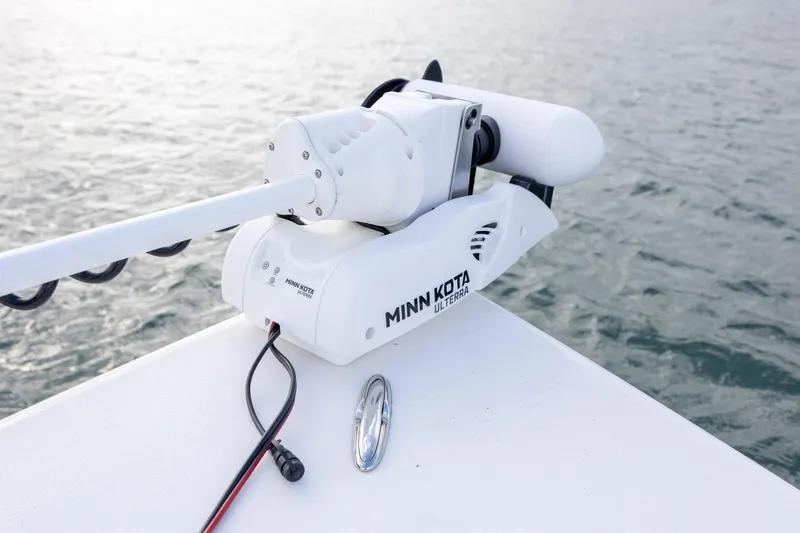 Slide: The Image of 2024 Sea Pro 228 Bay with Minn Kota Ulterra trolling motor on water. - 12