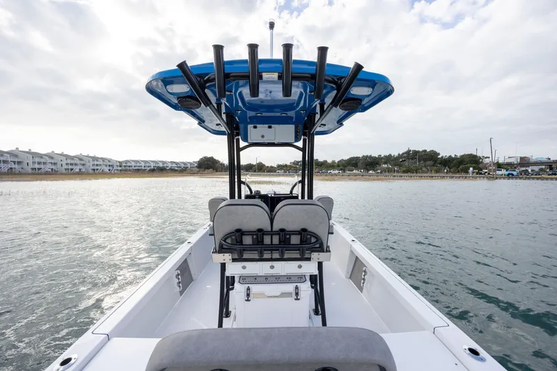 Slide: The Image of 2024 Sea Pro 228 Bay boat on water, featuring modern design and spacious seating. - 16