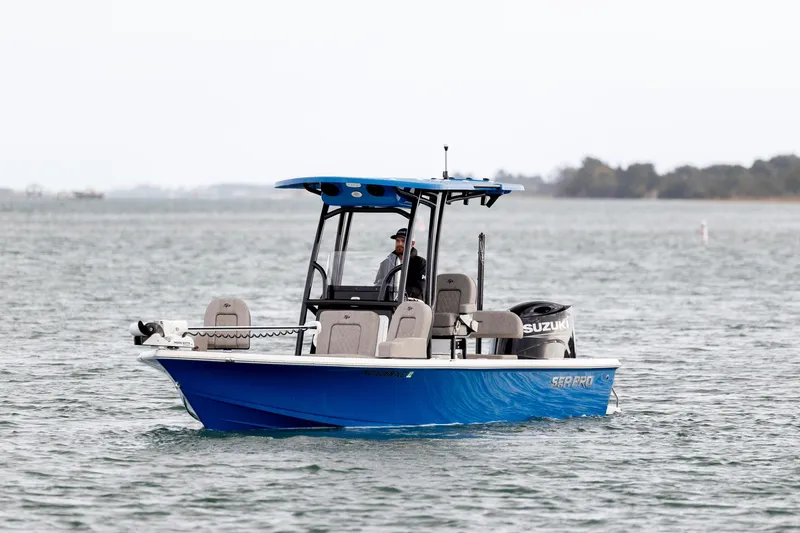 Slide: The Image of 2024 Sea Pro 228 Bay boat cruising on open water. - 3
