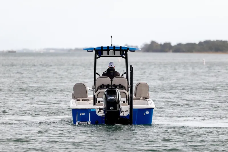 Slide: The Image of 2024 Sea Pro 228 Bay boat cruising on open water, rear view. - 6