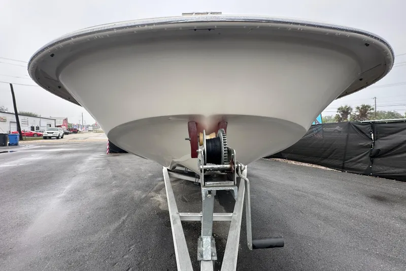 Slide: The Image of 2016 Carolina Skiff 218 DLV boat on trailer, viewed from the front. - 11