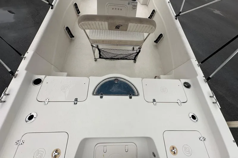 Slide: The Image of 2016 Carolina Skiff 218 DLV boat interior with seating and steering console. - 13
