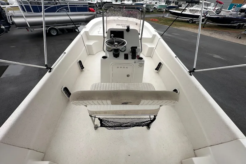 Slide: The Image of 2016 Carolina Skiff 218 DLV boat interior with seating and storage. - 15