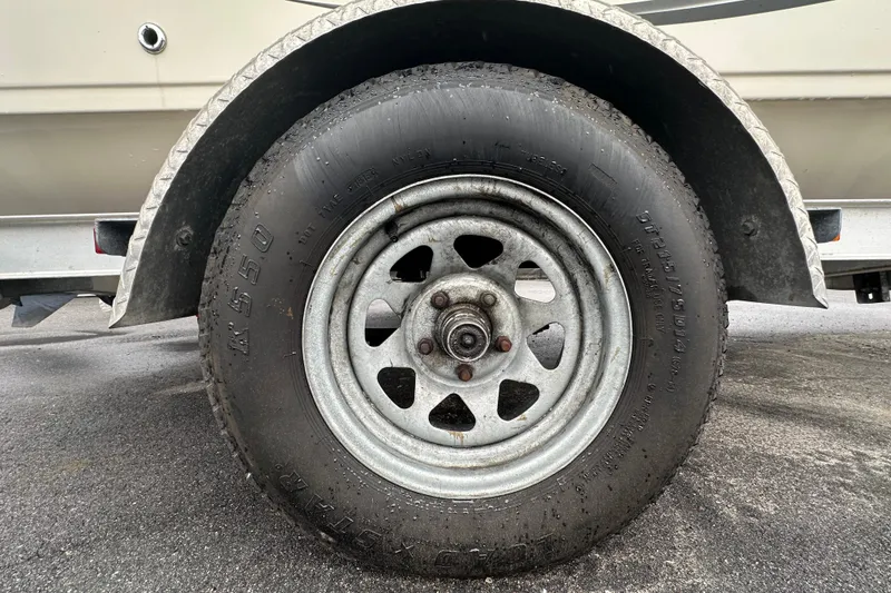 Slide: The Image of 2016 Carolina Skiff 218 DLV boat console with steering wheel and gauges. - 19