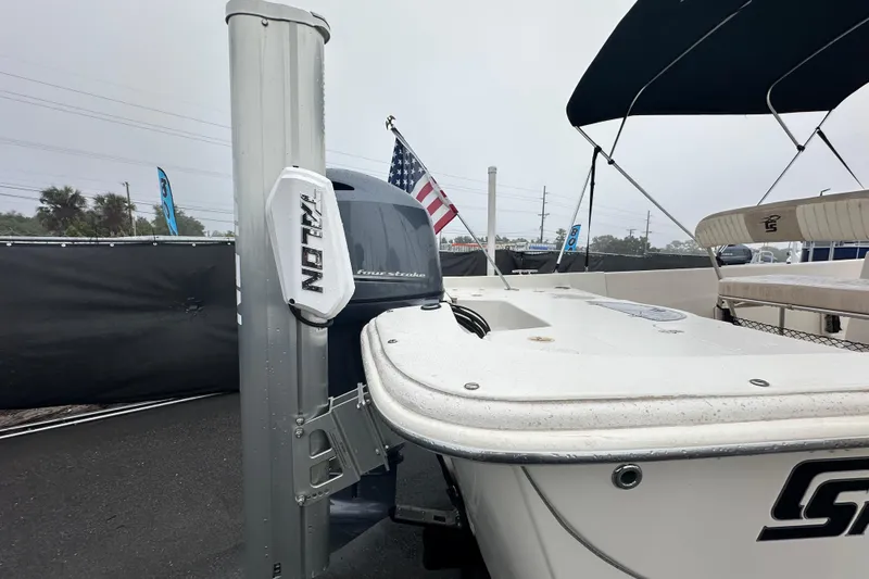 Slide: The Image of 2016 Carolina Skiff 218 DLV boat on trailer with Yamaha outboard motor. - 2