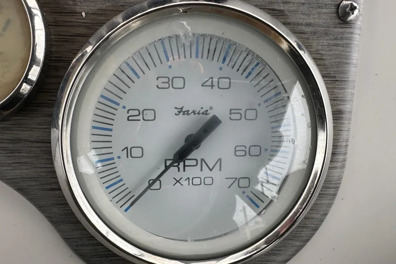 Slide: The Image of Open storage compartment on a 2016 Carolina Skiff 218 DLV boat, showing interior details. - 25