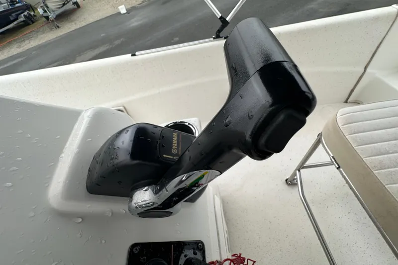 Slide: The Image of 2016 Carolina Skiff 218 DLV boat interior with seating and storage compartments. - 27