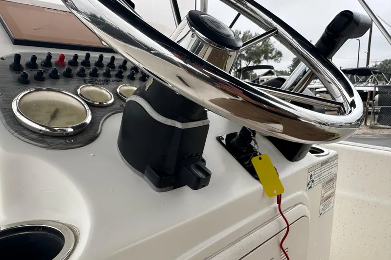 Slide: The Image of 2016 Carolina Skiff 218 DLV boat deck with storage hatch and shadow. - 29
